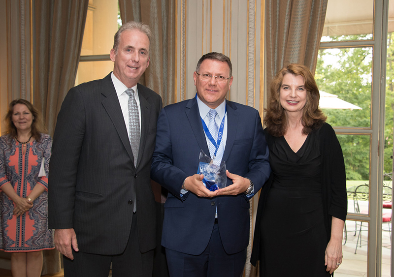 John McMahon and Ruthanne Terrero presenting an award to Villa dEste