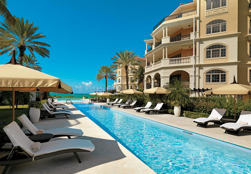 The reverse current lap pool at The Somerset on Grace Bay leads to a zero-entry infinity-edge pool