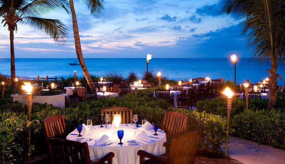 dining tables and chairs outside on a deck