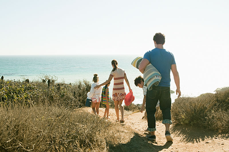 Family walking to the beach