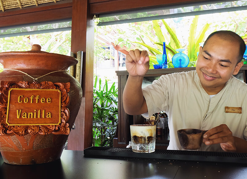 bartender Gusi Ngurah Putu Oka Wirangga pouring a Wedang by Oka cocktail