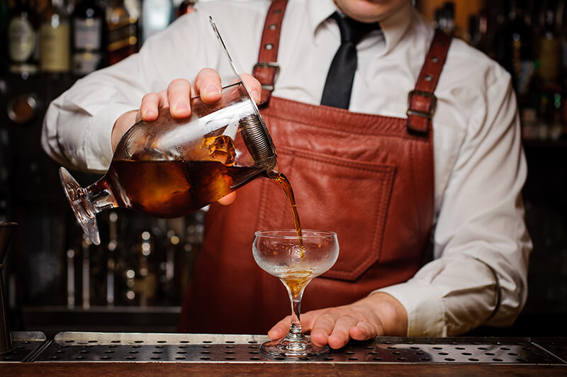 bartender pouring cocktail