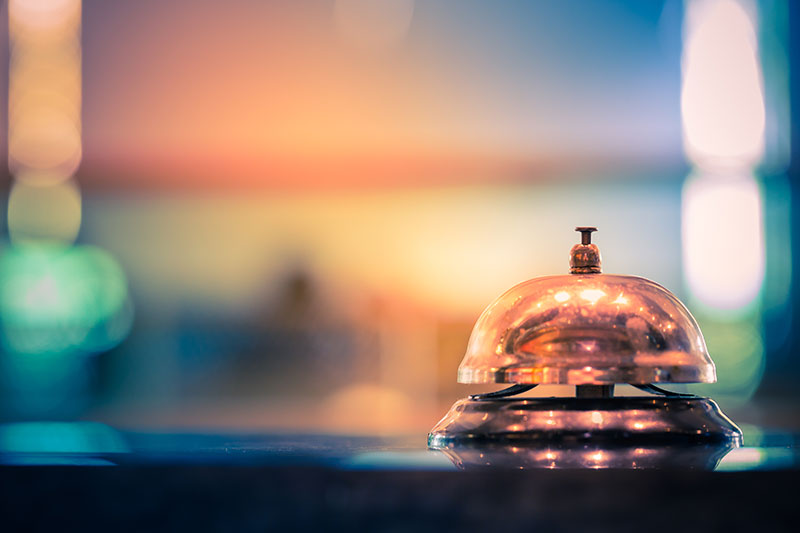 Bell at hotel desk