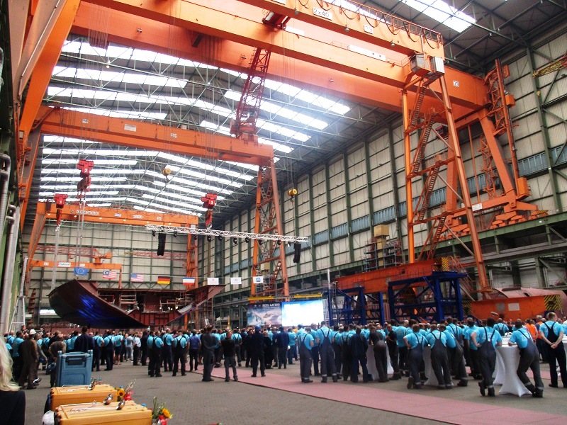 Shipyard workers at MV Werftens Stralsund shipyard await the arrival of German Federal Chancellor Angela Merkel Photo by Su