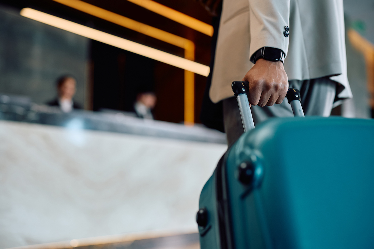 Traveler checking infront deskbusiness traveler