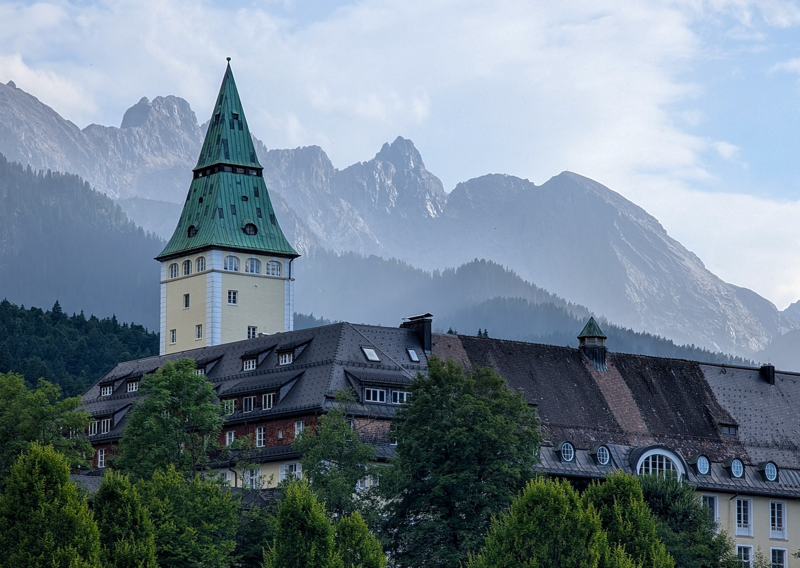 Schloss Elmau a luxury hotel and national monument is surrounded by forest in the Bavarian Alps Wetterstein Mountains in 