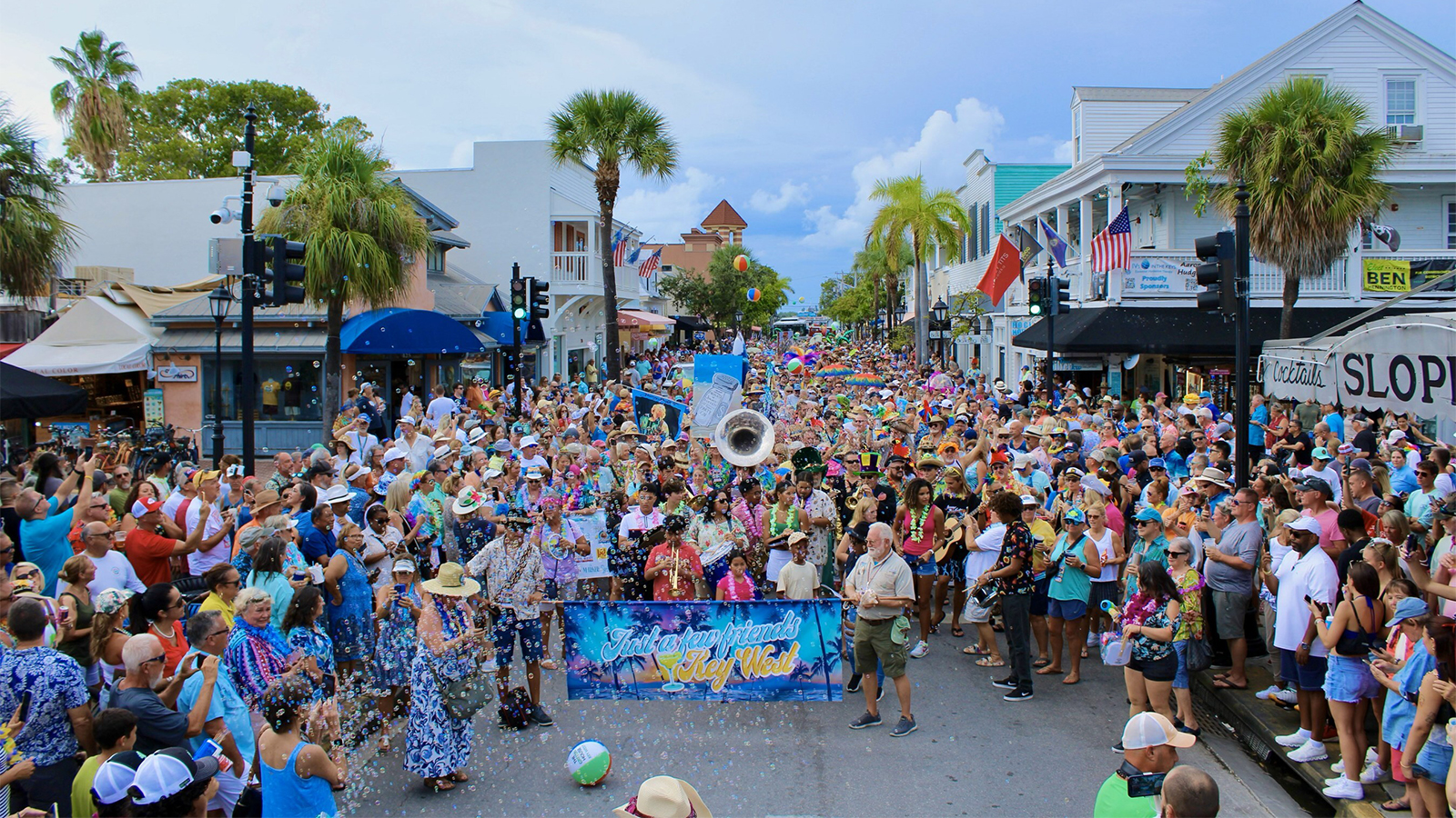 Fans of the late Jimmy Buffett join the colorful Second Line parade down Duval Street during the 2024 Just a Few Friends fest