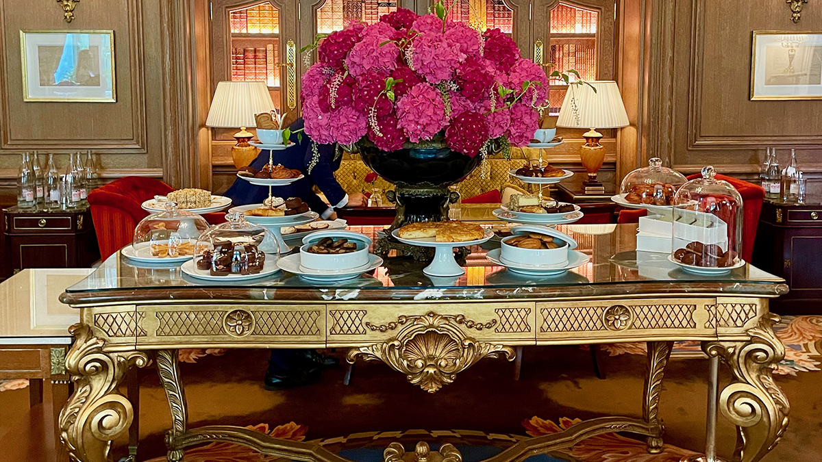 A selection of pastries on a gilded table at the Ritz Paris