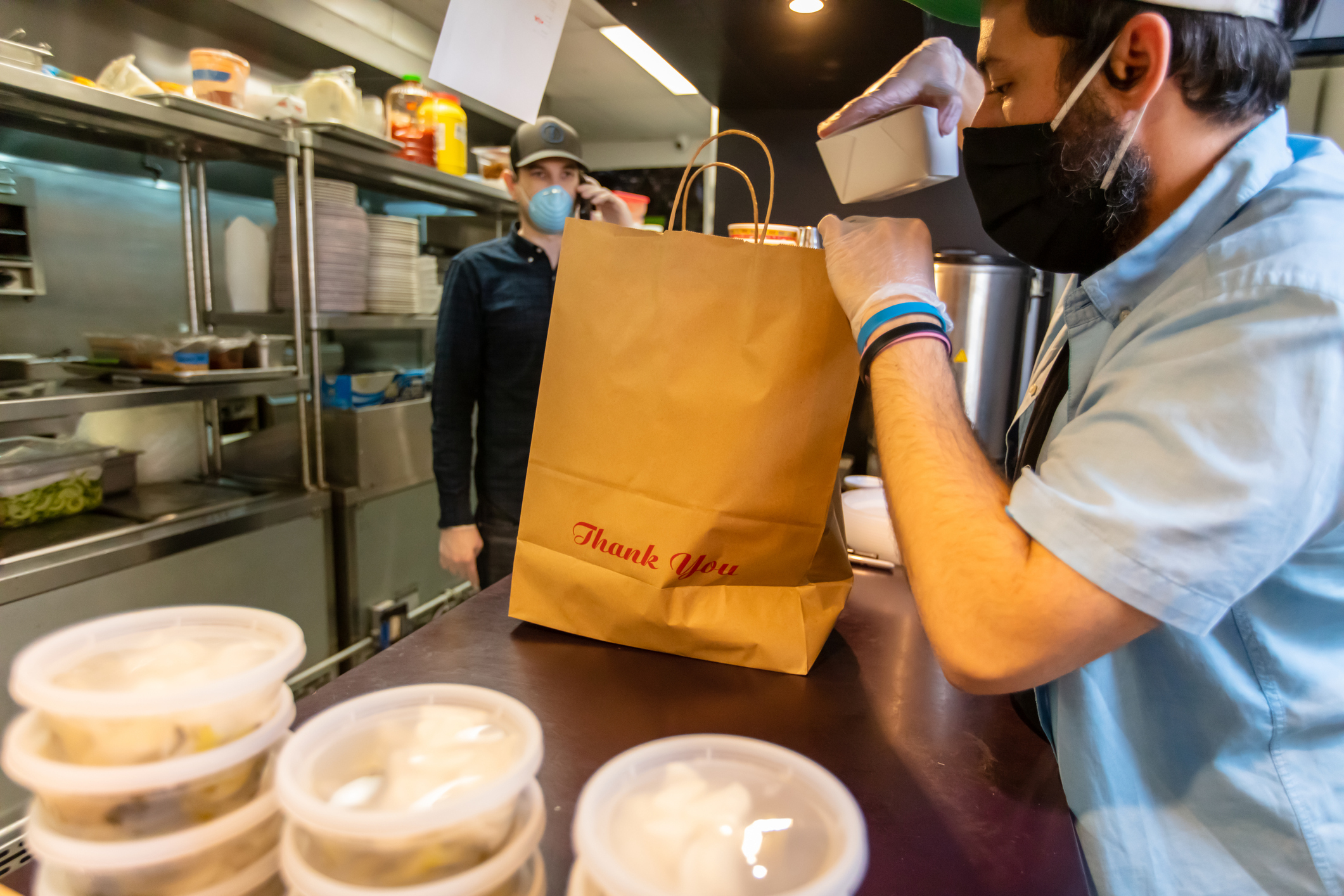 a man packs a delivery bag