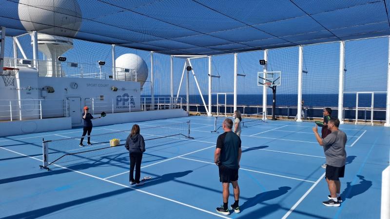 All Holland America ships have pickleball courts. Here guests play on National Pickleball Day 2025 on Rotterdam.