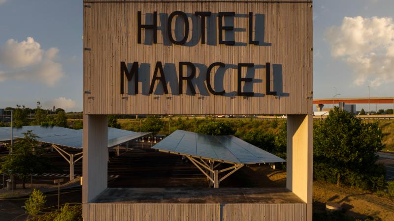 Hotel Marcel New Haven Tapestry Collection by Hilton Exterior Billboard Signage Sunset