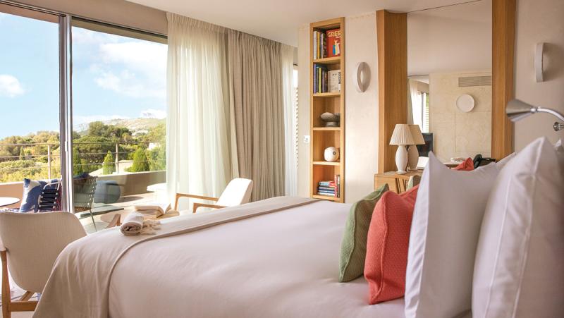 Sophisticated Redesign: La Réserve Ramatuelle has 19 rooms and eight suites, all of which were redesigned by Jacques Garcia in 2024. Shown here is the Deluxe Room with Sea View and Terrace.