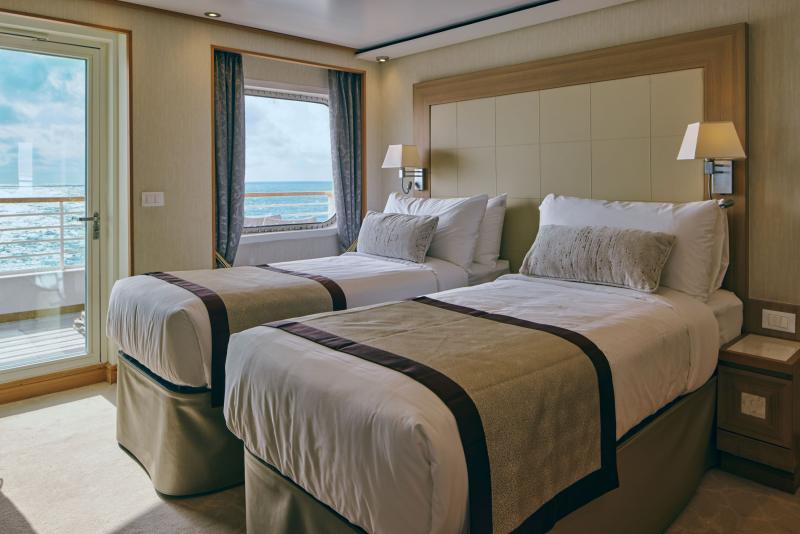 A suite set up in a twin-bed configuration on Mitsui Ocean Fuji.