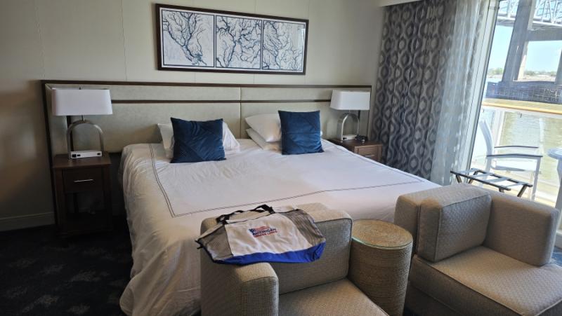 In a Veranda Suite on American Serenade, the king-sized bed can be split into two twins. A split love seat -- creating two separate chairs -- has a small round table between. On our cruise a tote bag was waiting upon our arrival on embarkation day.