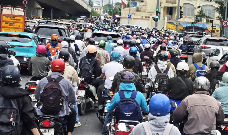 Motorcyclists and scooter operators are prolific on the streets of Ho Chi MInh City, Vietnam.