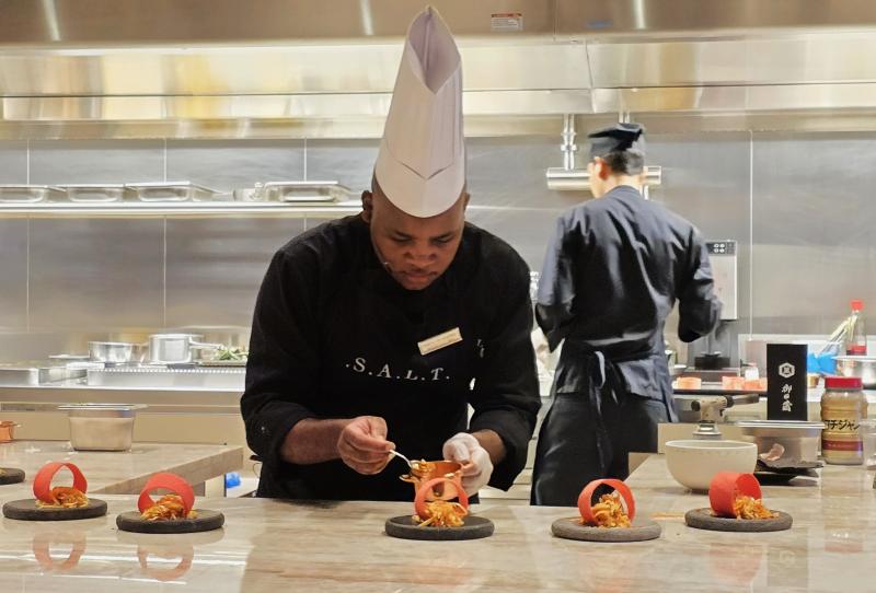 On Silversea's Silver Nova, a chef prepares one of 11 tasting courses for the Chef's Table at S.A.L.T. Lab experience.