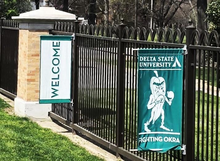A banner showing a "Fighting Okra," the mascot of Delta State University, Cleveland, MS.