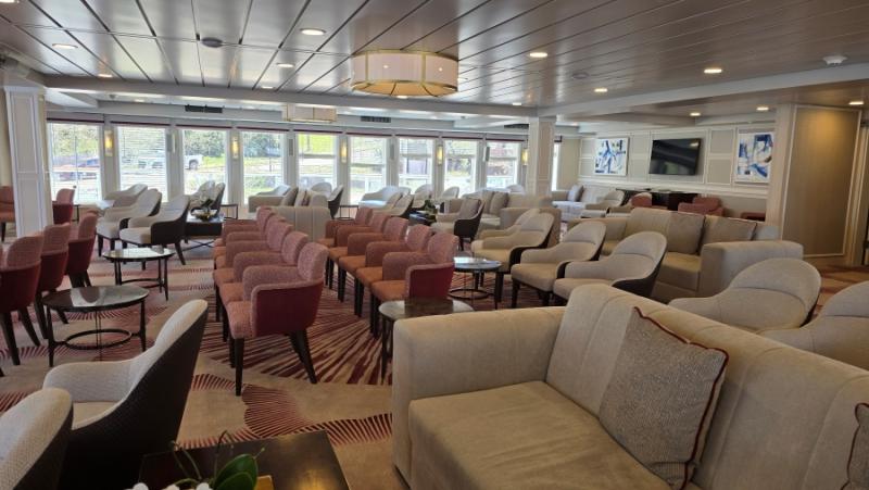 The River Lounge is empty here, but it's a hub of activity for enrichment lectures, port briefings, cocktail hour, and live nightly entertainment.