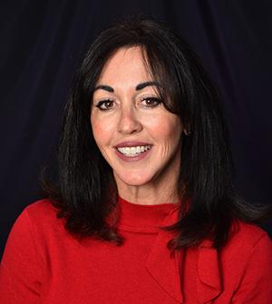 image of woman with dark hair in red sweater