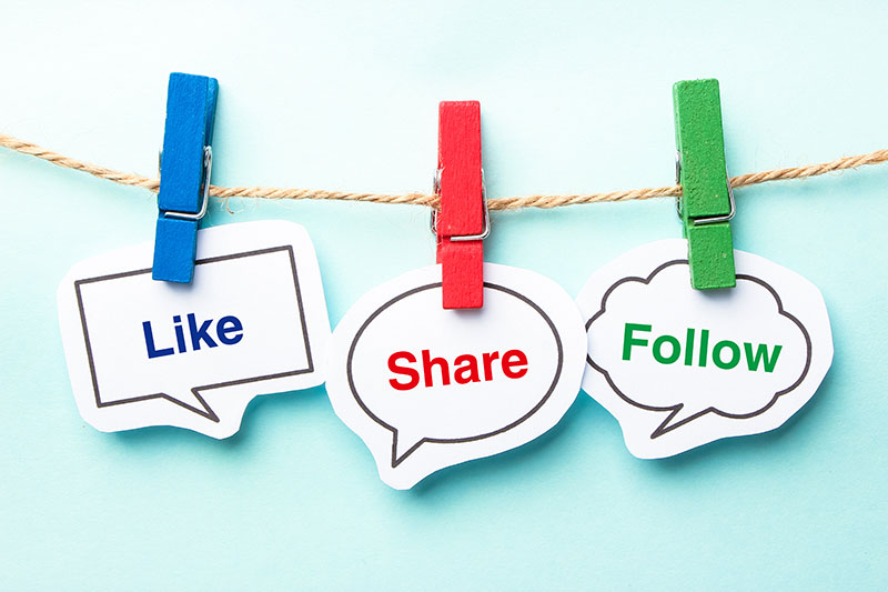 Like share and follow bubbles on a clothesline