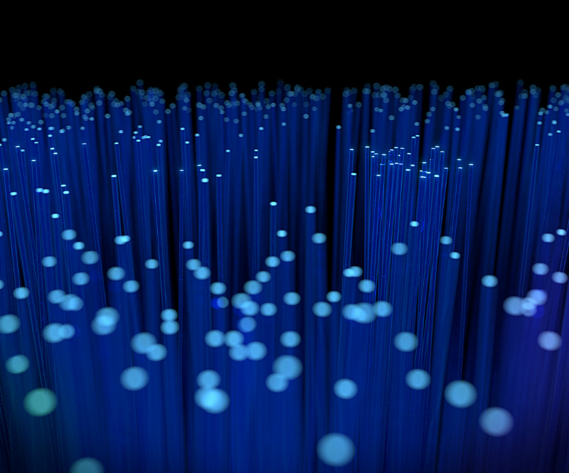 glowing blue rods with a dark background