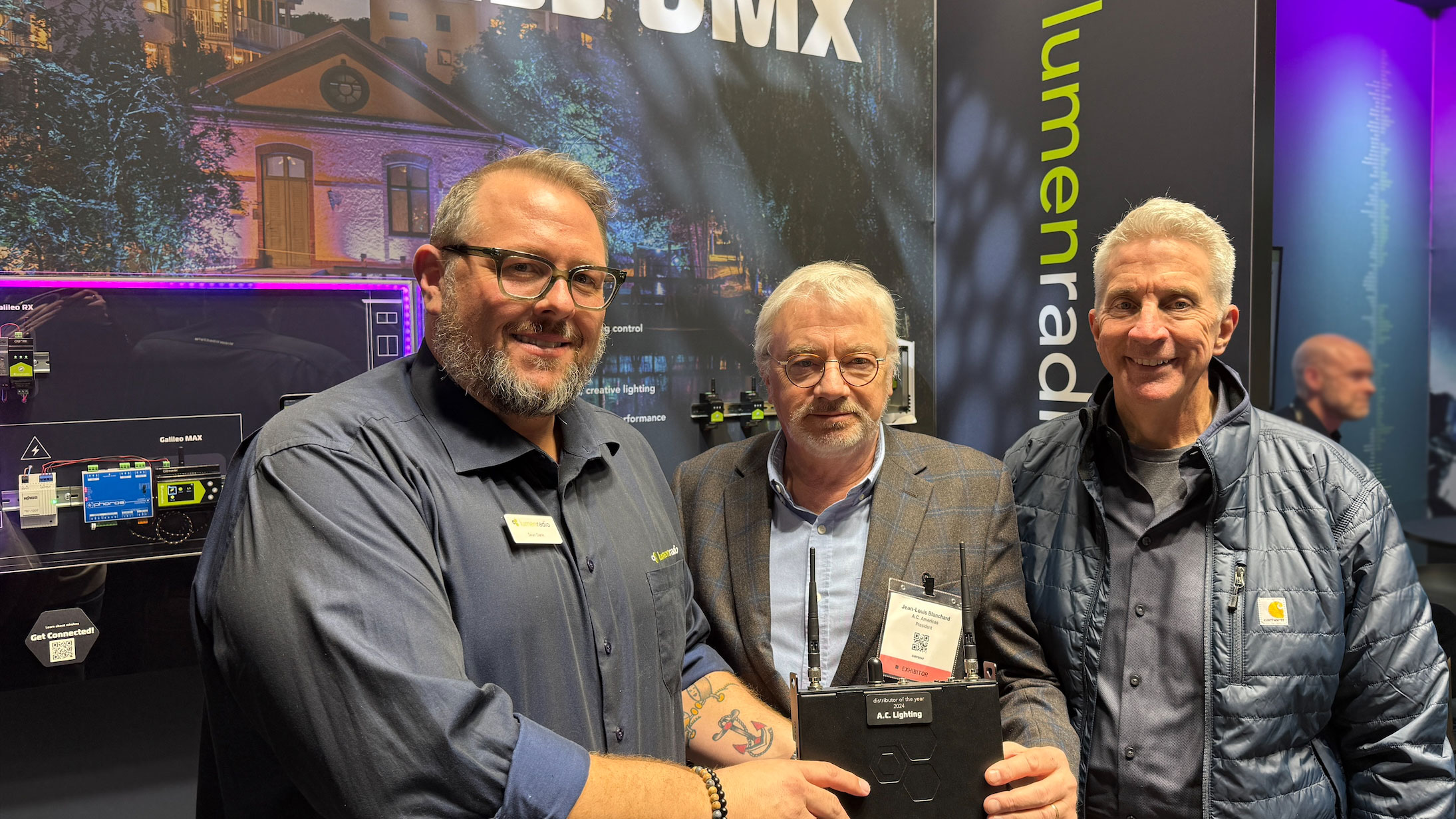 Sean Dane International Sales Manager for LumenRadio presented the award to Jean-Louis Blanchard President of AC Lightin