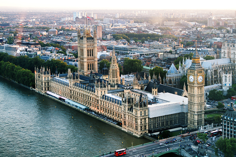 Big Ben and Houses of Parliament On River Thames in London 