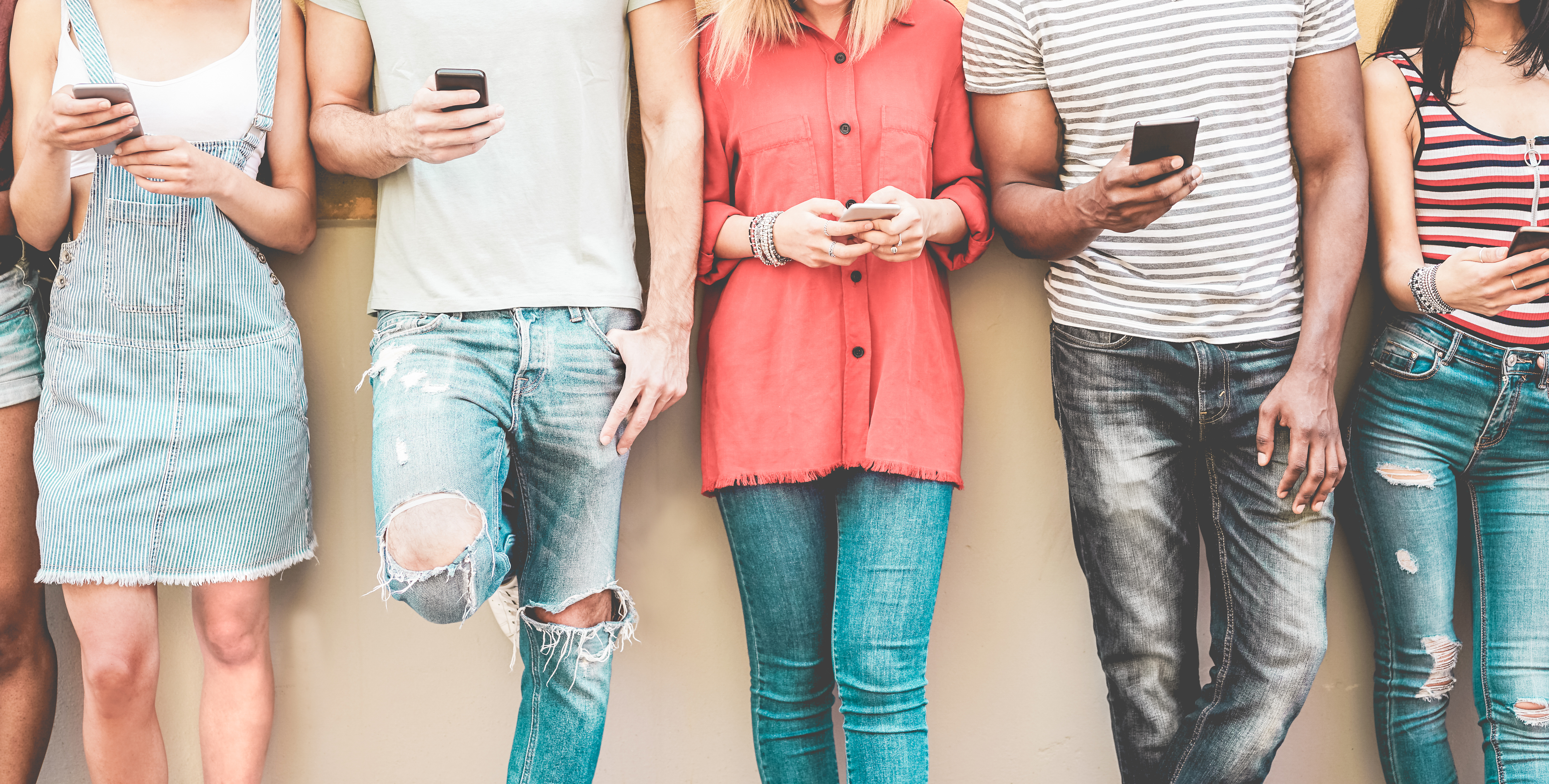 group of people holding smartphones