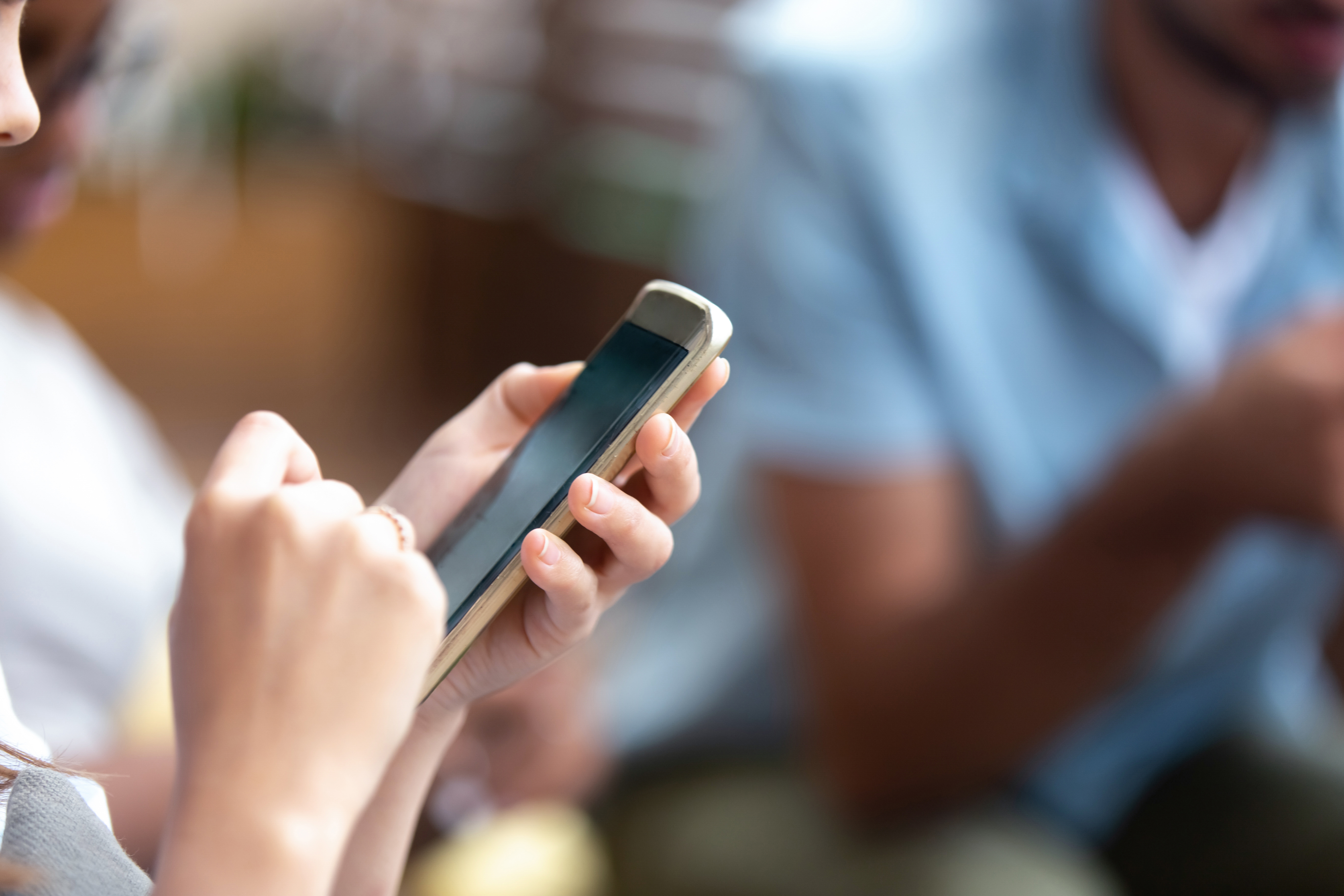 woman holding smartphone
