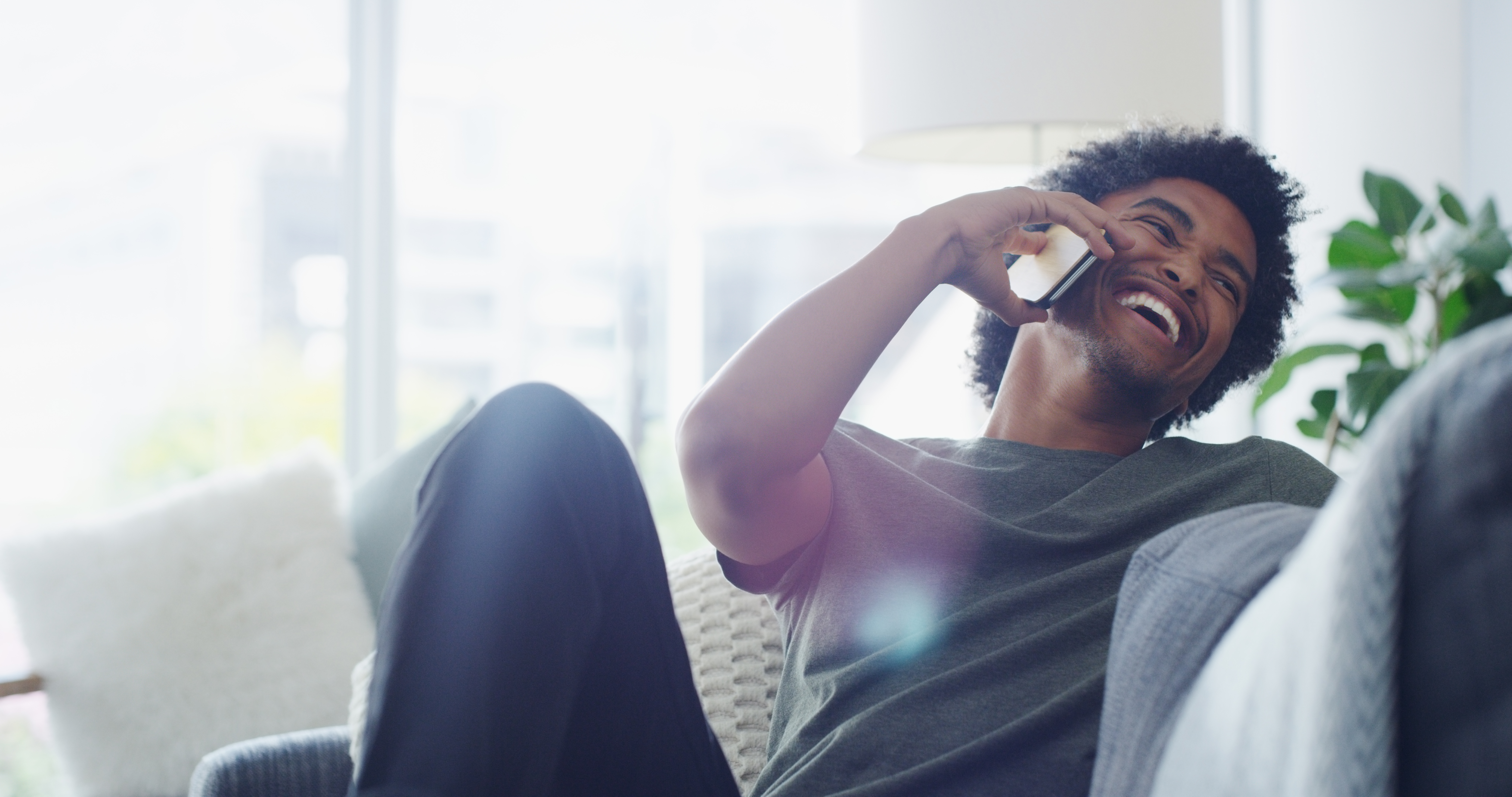 person on smartphone at home