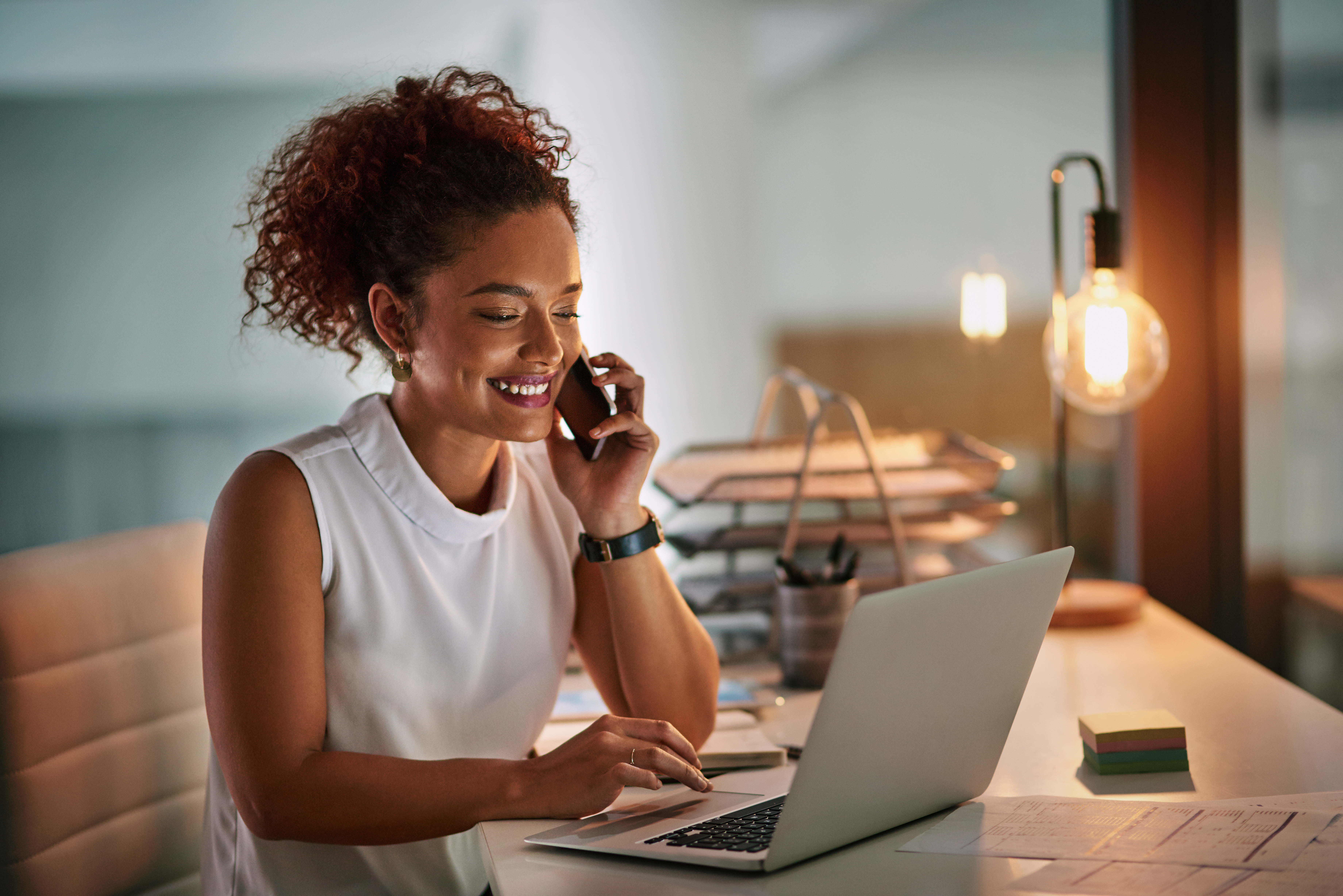 woman on cell phone and computer