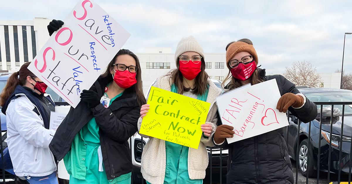 Nurses holding picket signs