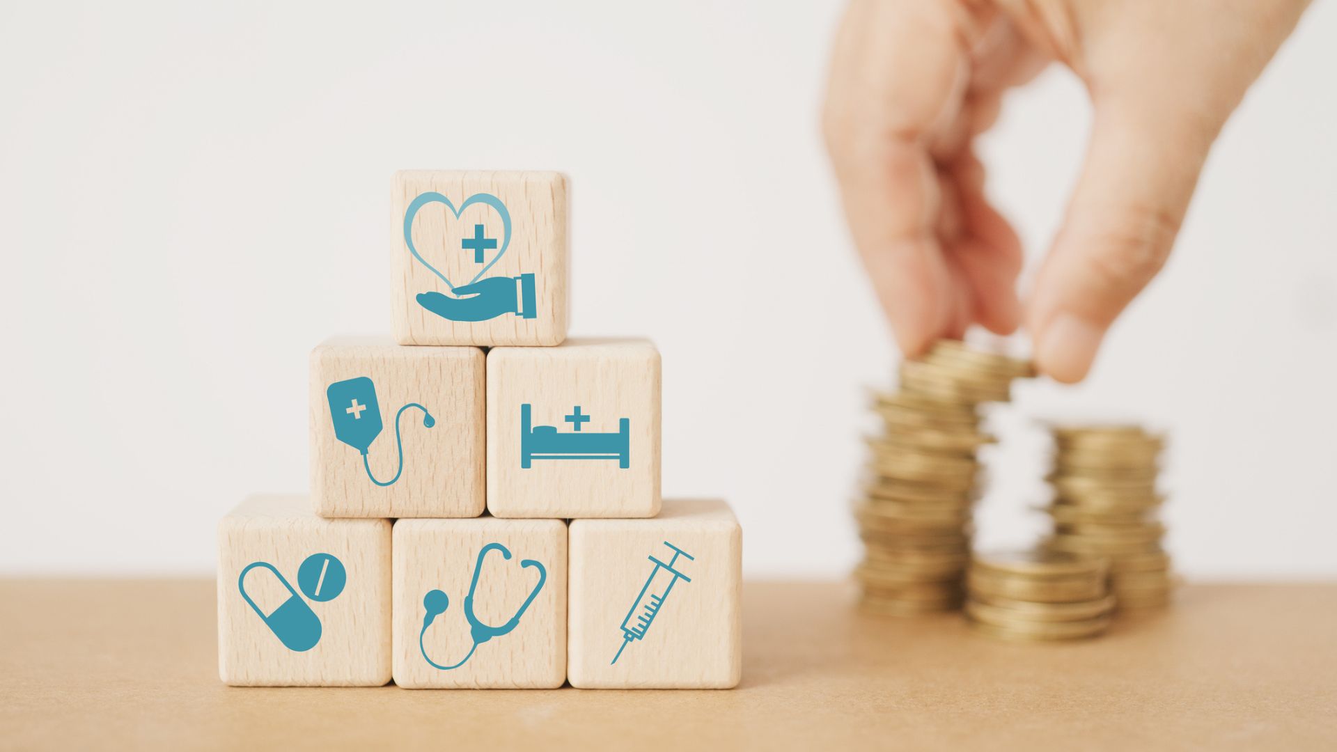 Healthcare savings symbolized by wooden blocks