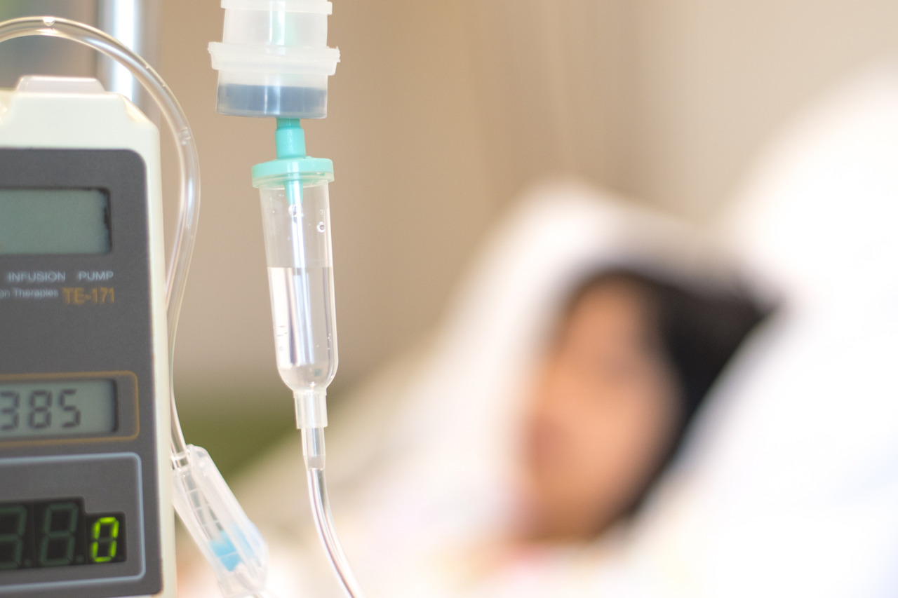 pediatric patient in hospital bed with IV line