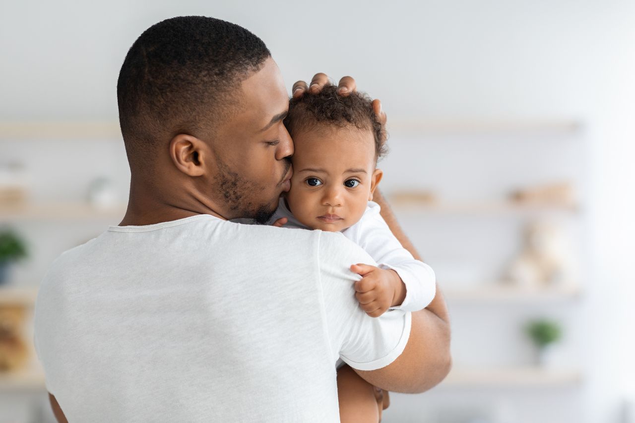 Father holding infant