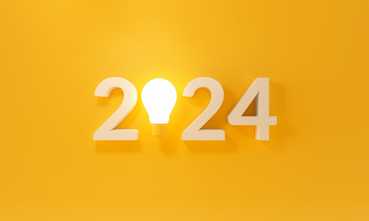Bulb light with new year 2024 on yellow background