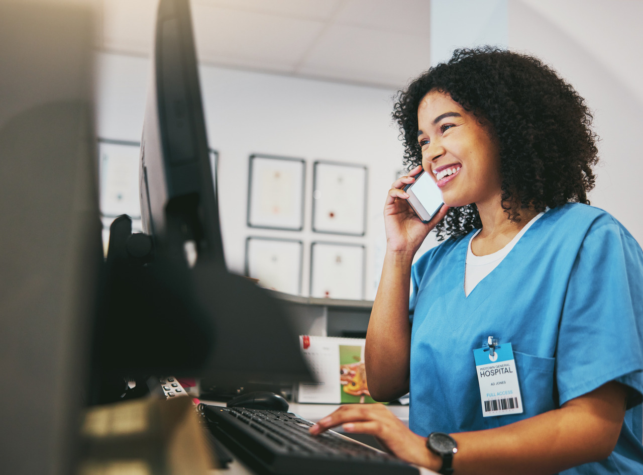 nurse speaking on the phone frontline staff at medical practice
