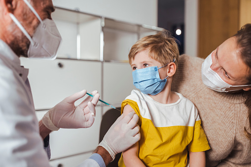 Young kid getting vaccine