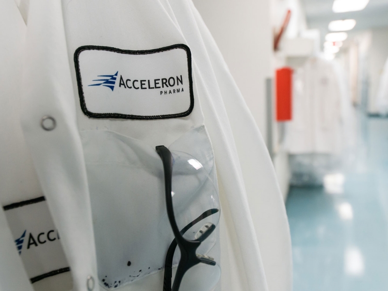 Acceleron badge on lab coat