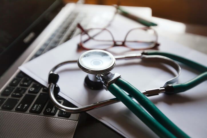 A stethoscope on a computer keyboard