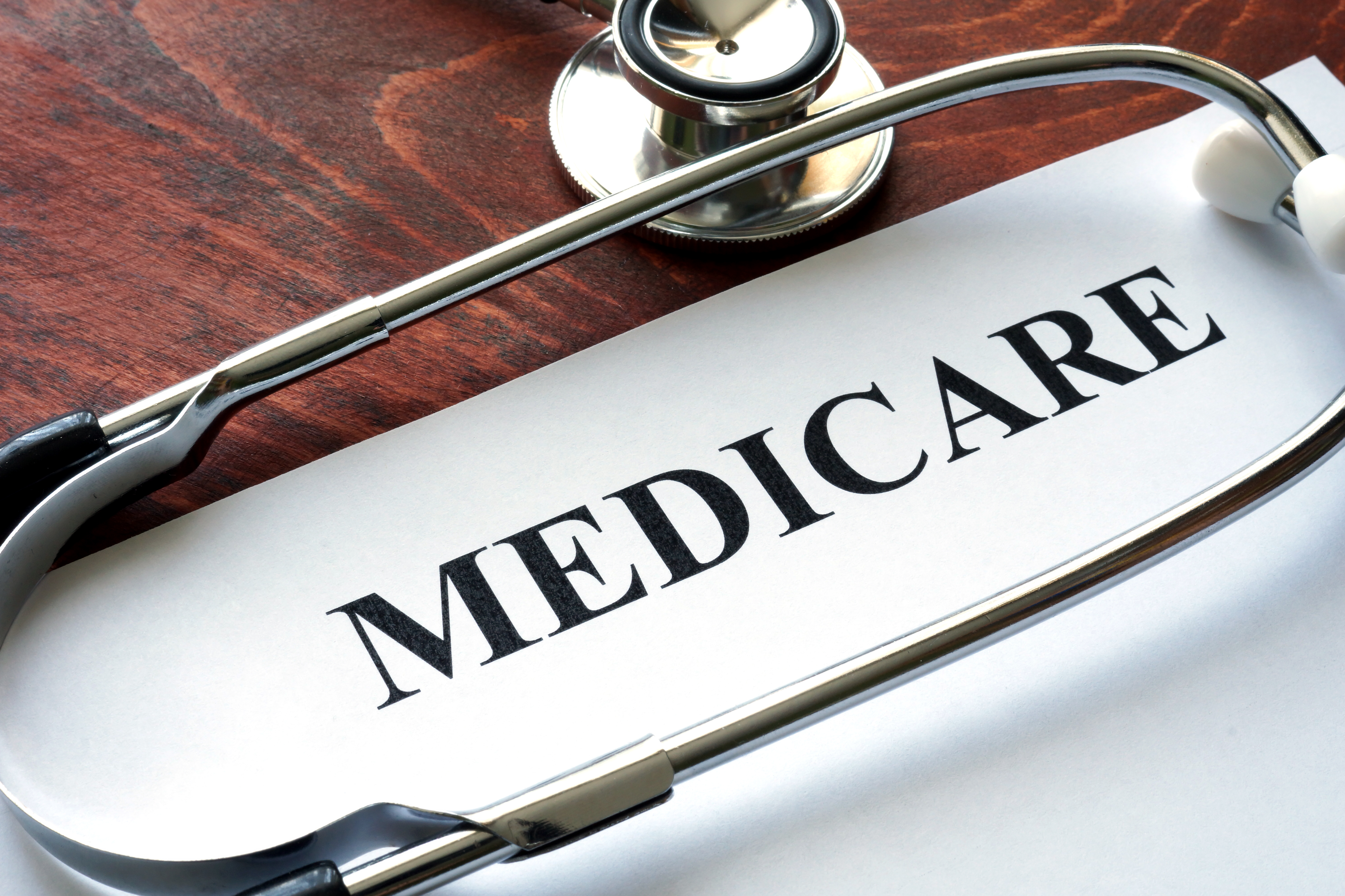 Medicare written on paper with a stethoscope 
