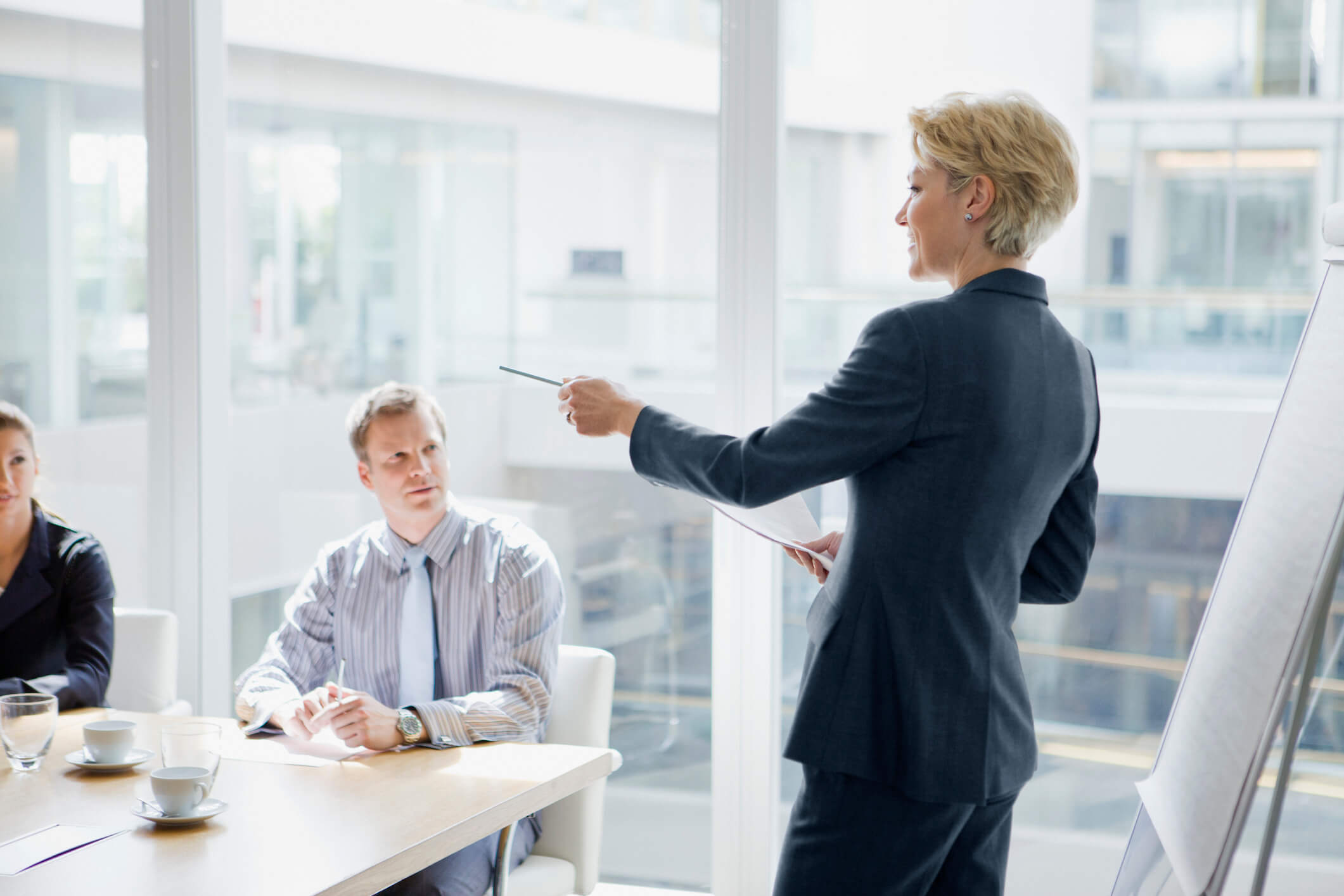 Female executive leading meeting