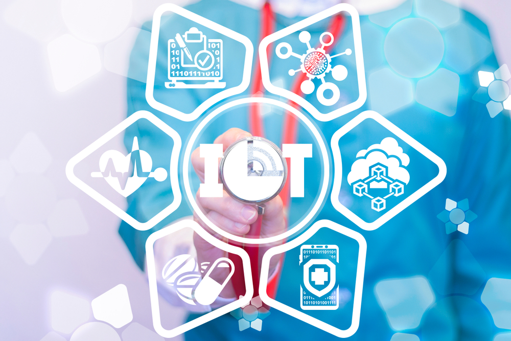 doctor putting stethoscope up to medical technology concept