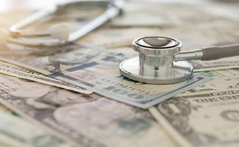 A stethoscope and paper money
