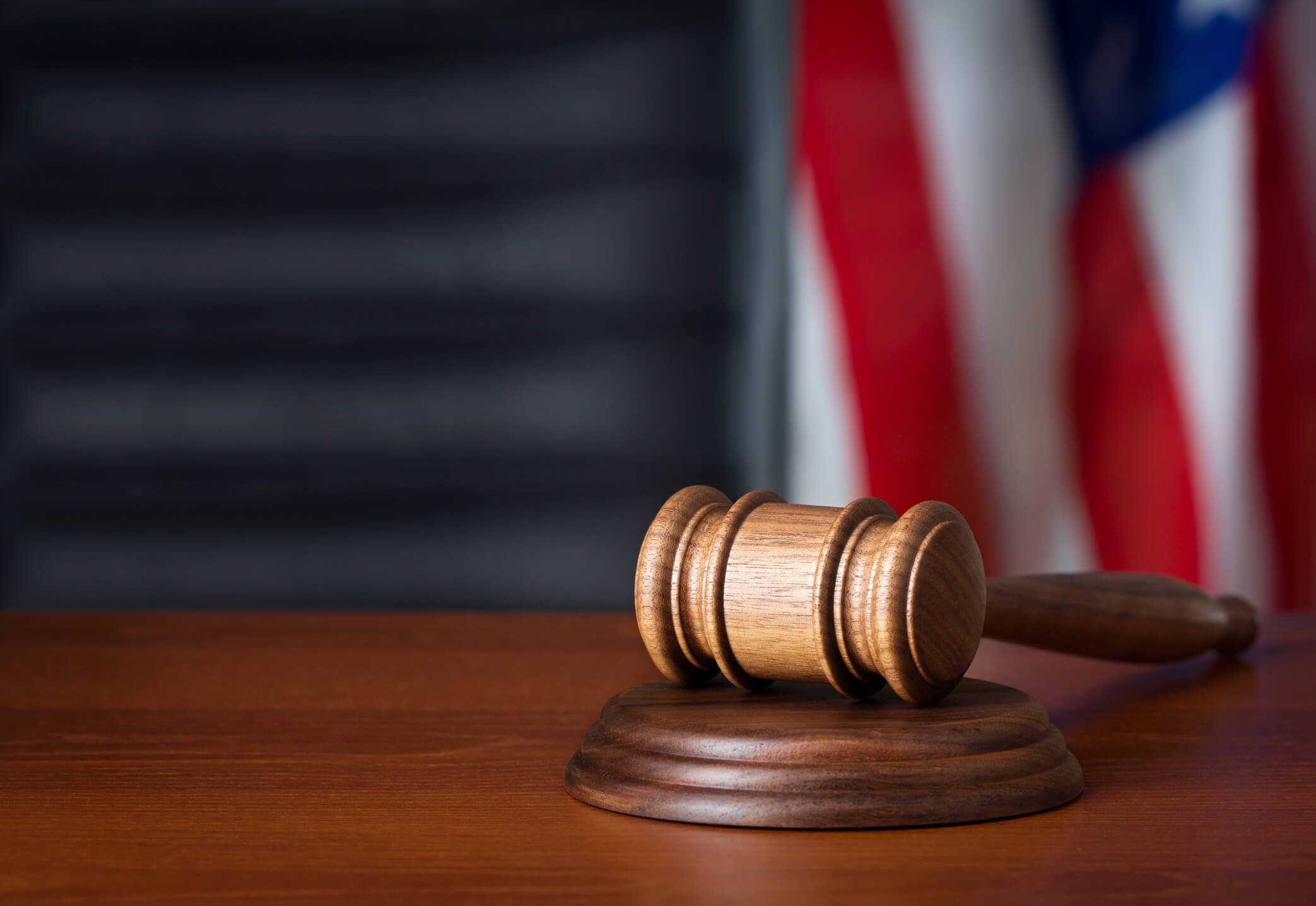 Gavel and flag in courtroom