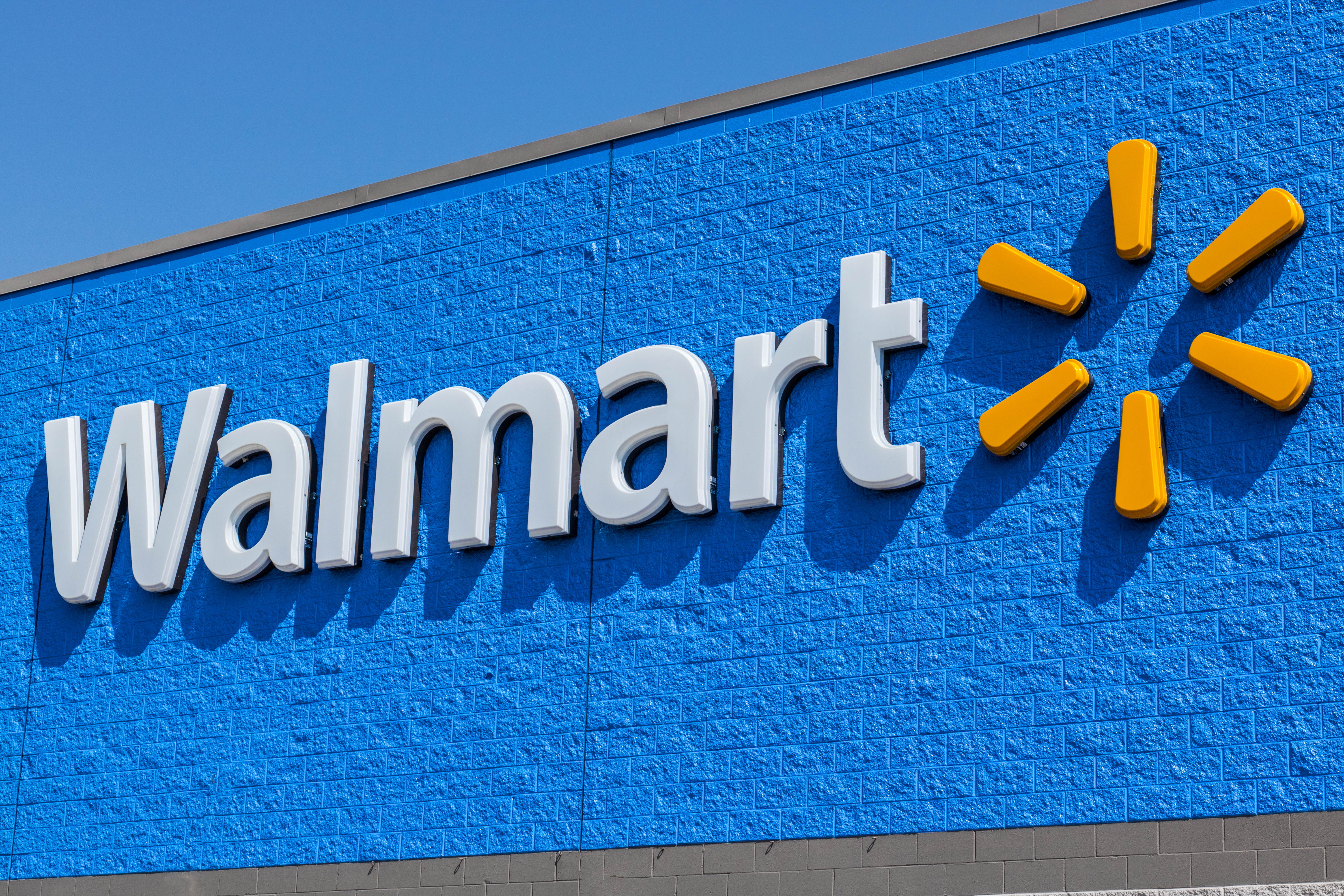 The sign at the front of a Walmart store