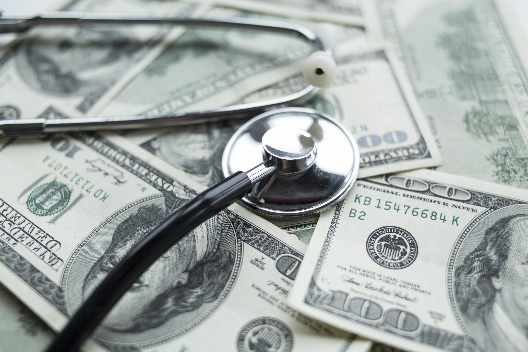 Stethoscope on dollars