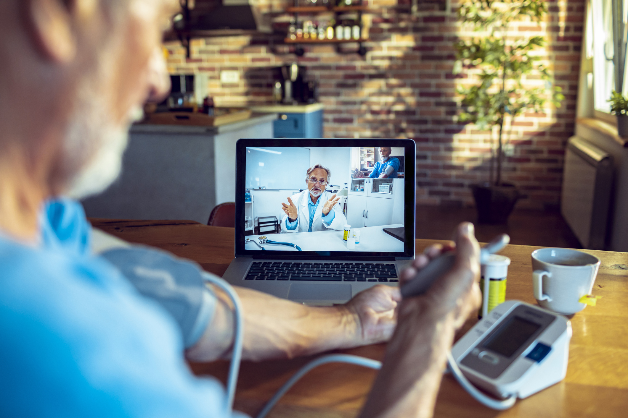 Senior patient consulting with doctor online during telehealth visit