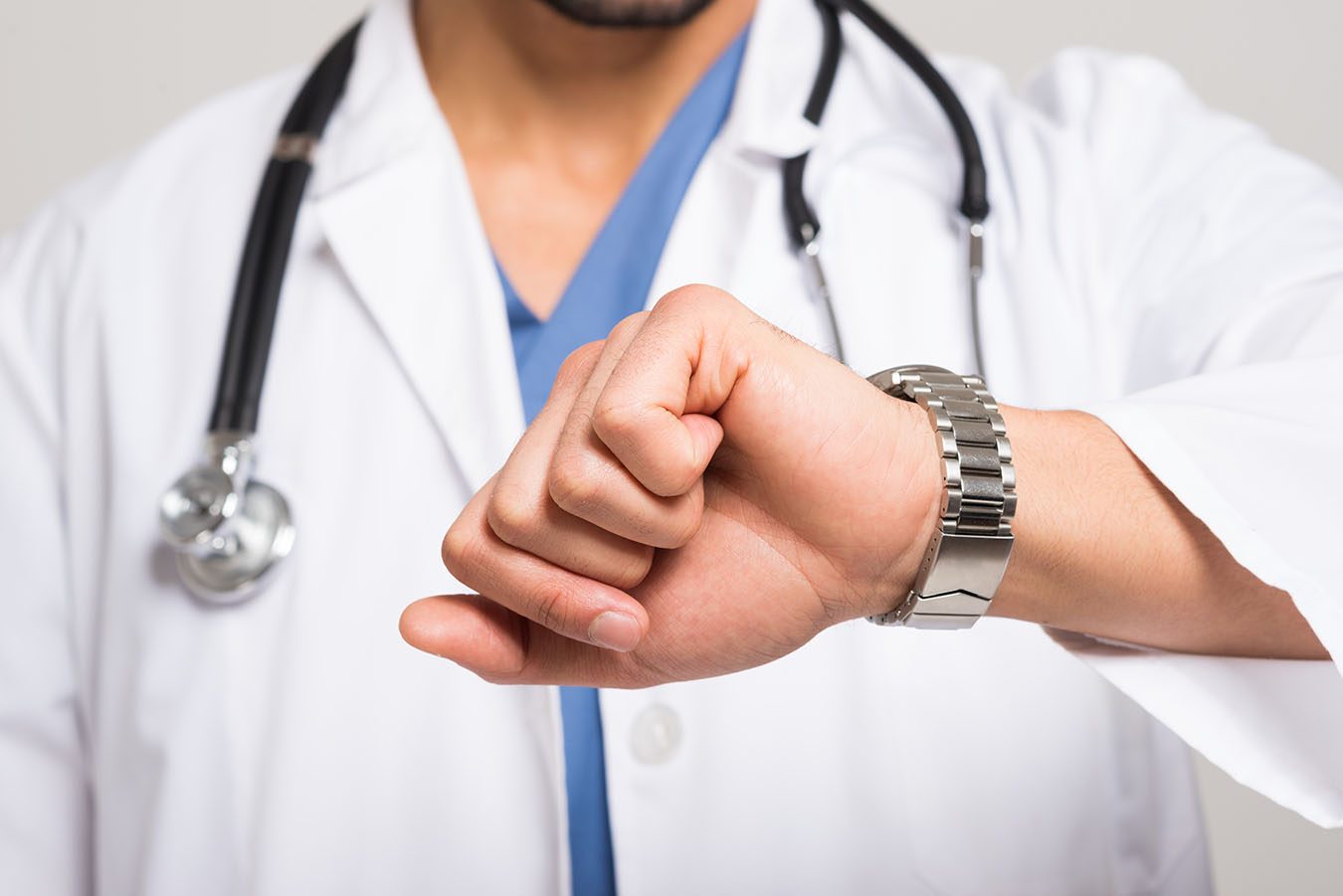 Doctor looking at time