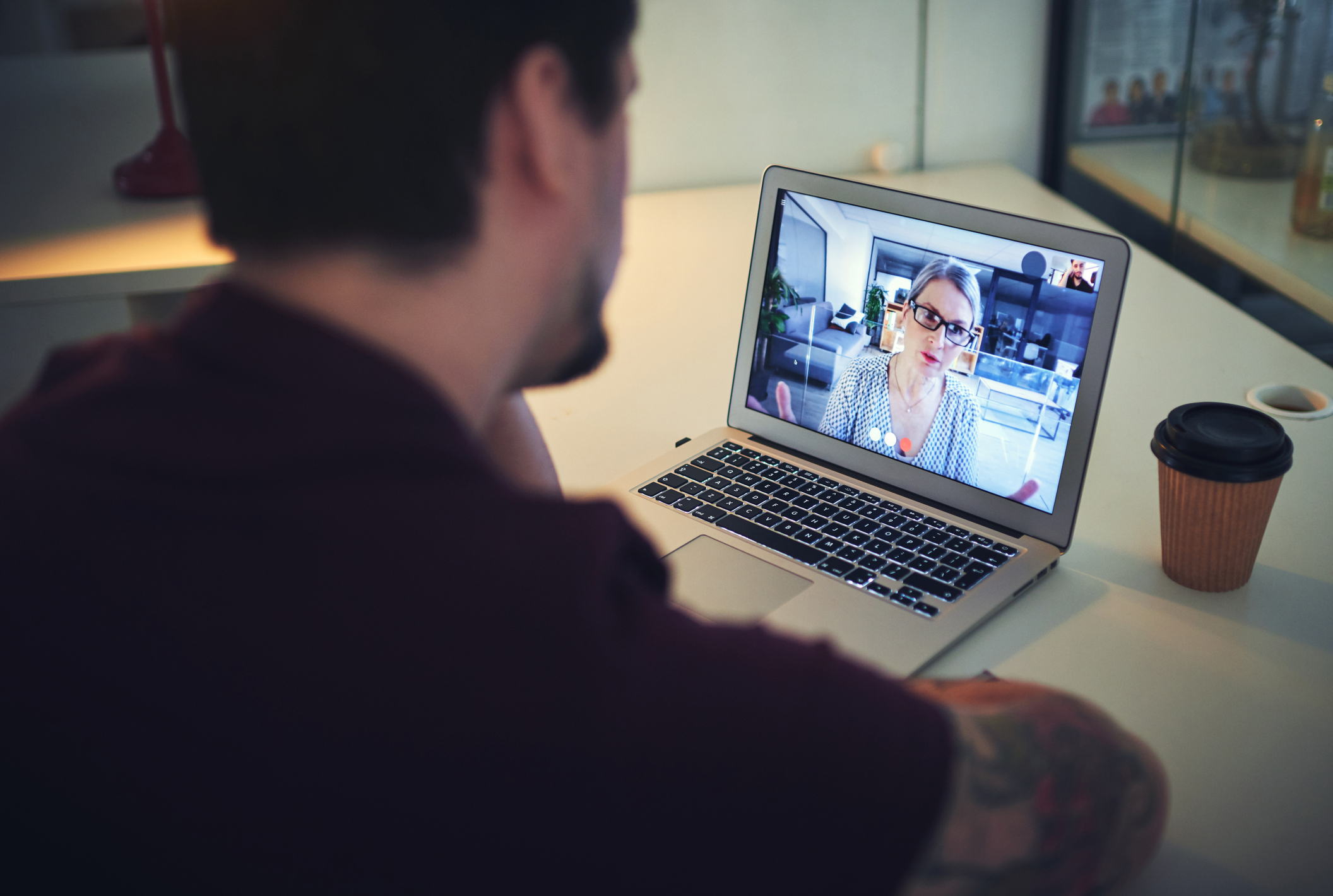 Photo of psychologist conducting an online therapy session with her patient